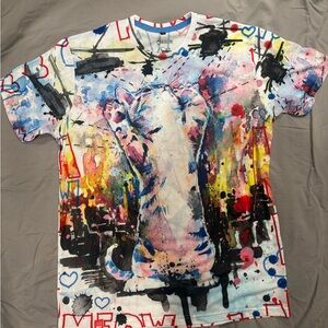 Herotime colorful graphic tee featuring “Catzilla” by artist Lora Zombie.